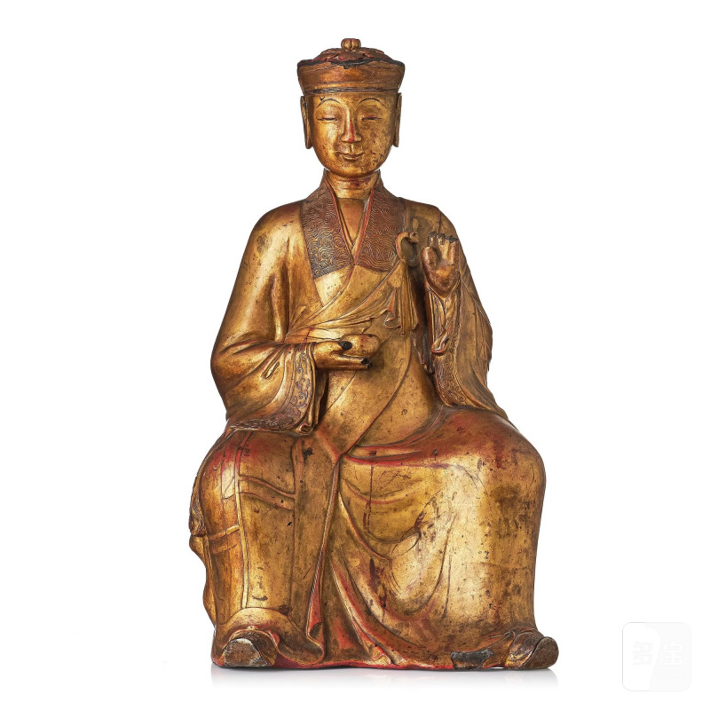 A large gilt lacquer figure of a deity,
